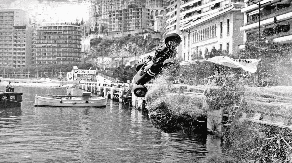 Paul Hawkins crashes through the barriers and ends up in the harbour during the 1965 Monaco Grand Prix